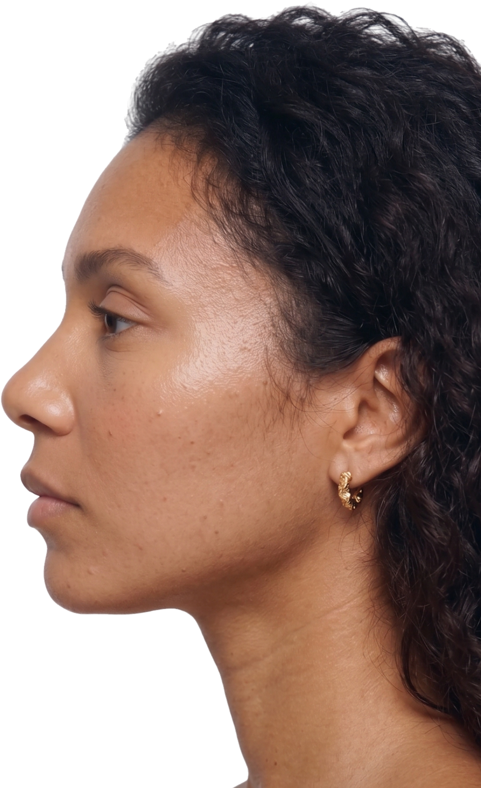 Close-up of a woman with light brown hair pulled back and her eyes closed